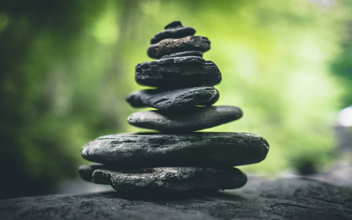 Elderly person practicing Tratak meditation in supervised setting